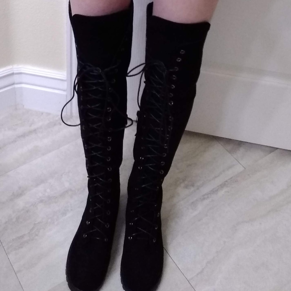 Black over-the-knee pull on low heel boots